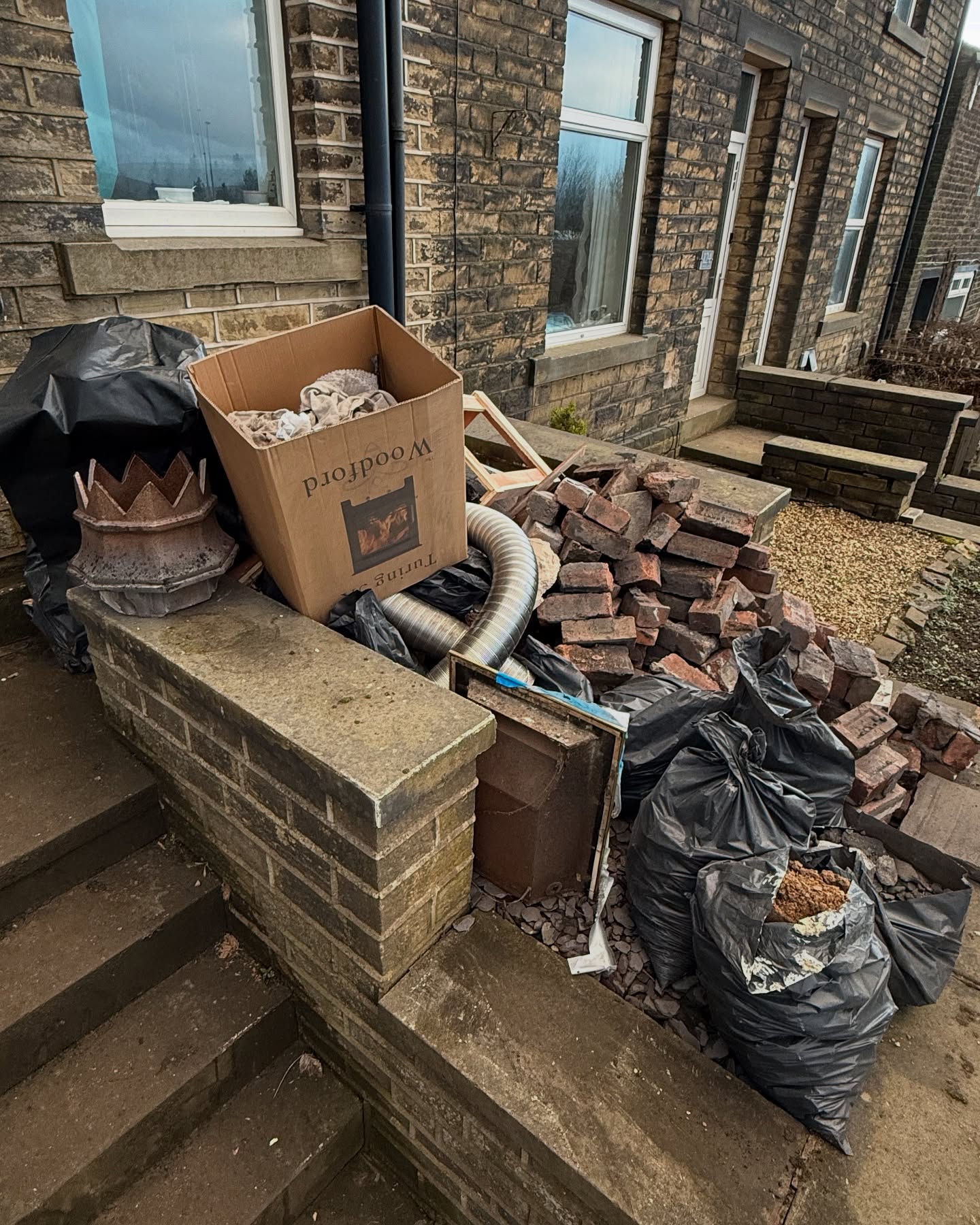 Bricks and waste ready for removal in West Yorkshire
