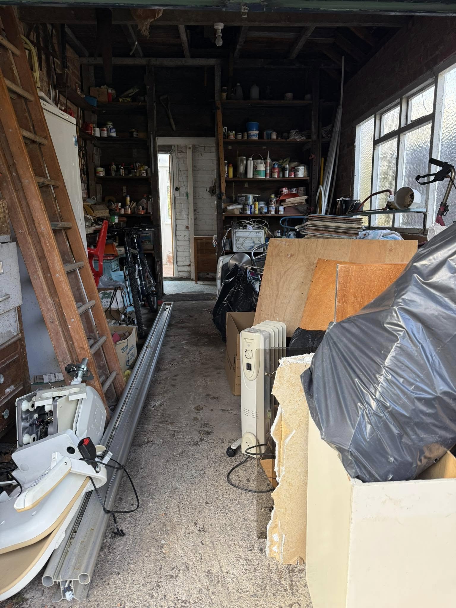 Garage with household waste to be collected in West Yorkshire