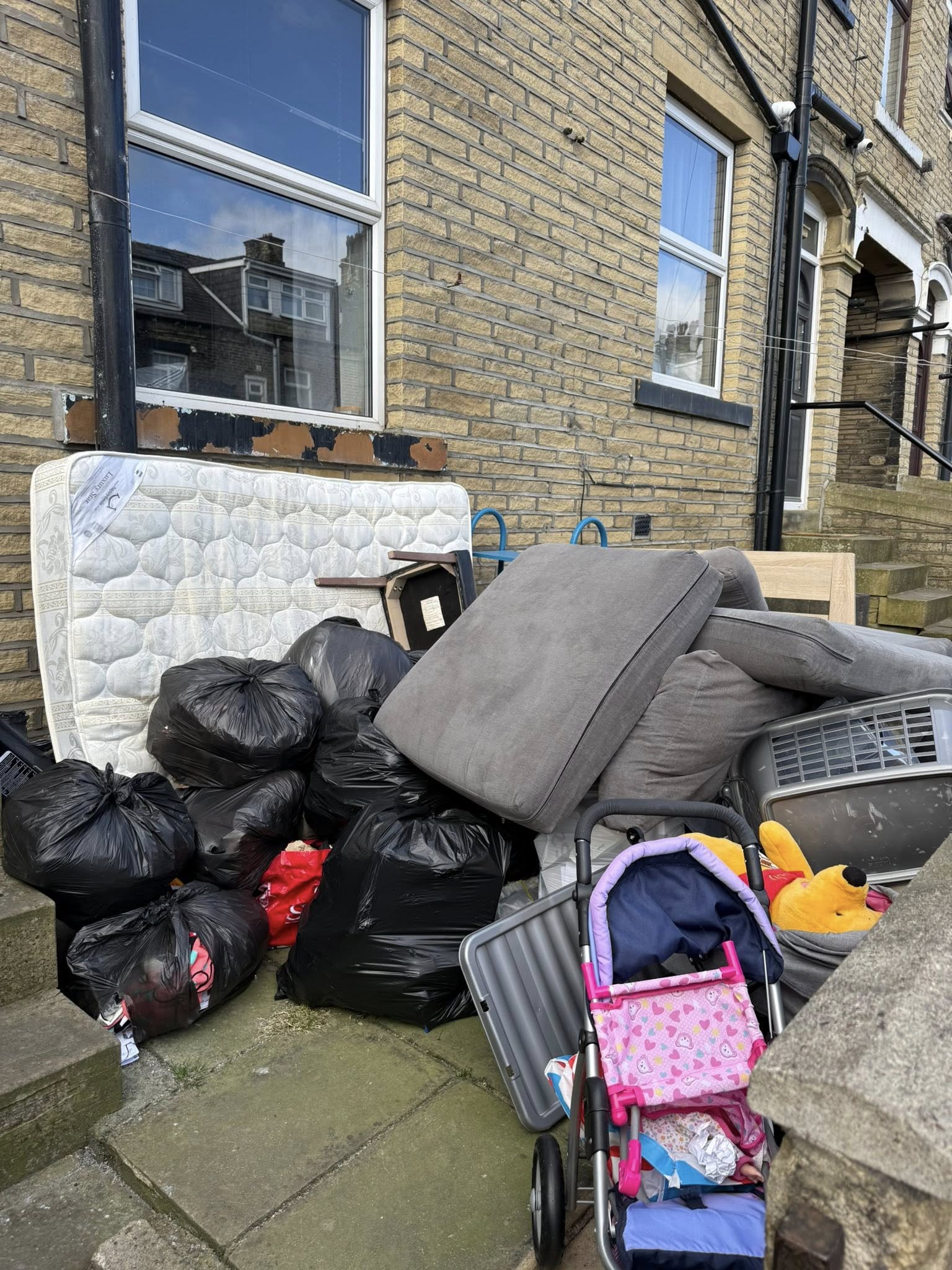 Sofa and household items waiting for removal in West Yorkshire