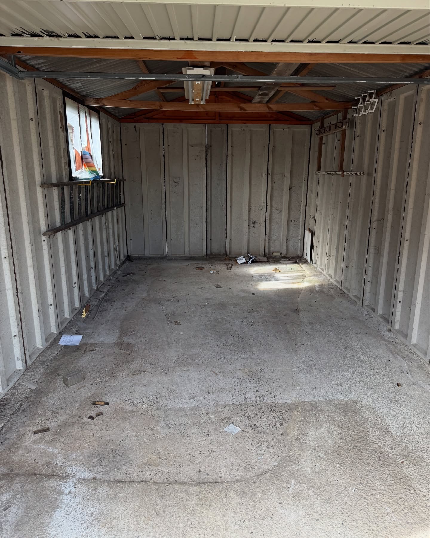 Empty garage after waste removal in West Yorkshire