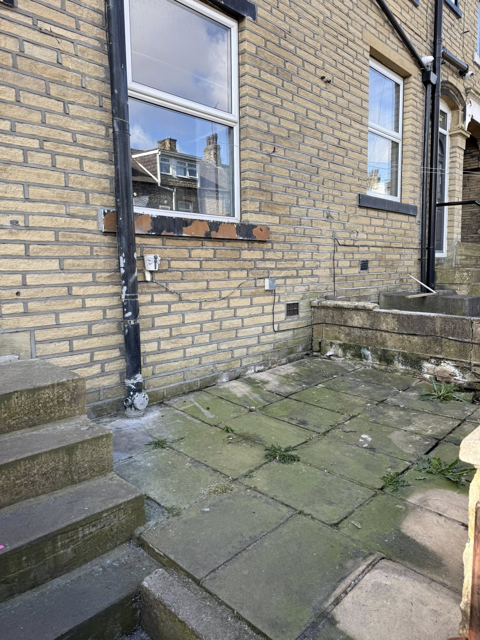 House patio cleared of waste in West Yorkshire